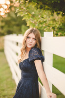 white fence senior photo