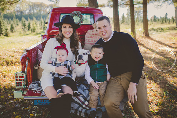 Red truck family with dog